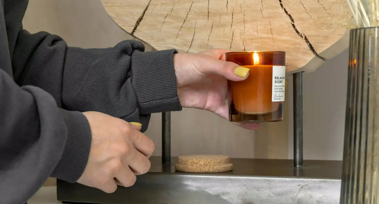 Person Holding Burning Candle